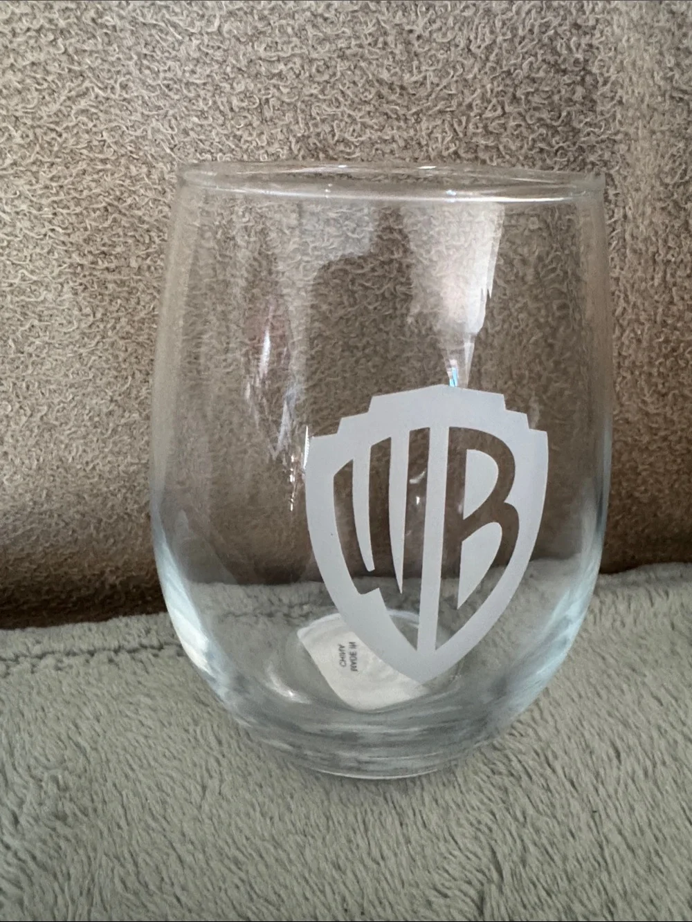 Warner Bros. Clear Stemless Wine Glass with White Etched WB Shield, new